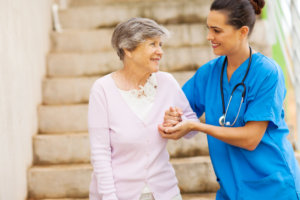 nurse helping elderly